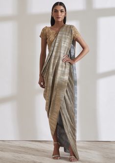 Our signature metallic 2.0 sari comes with a built in petticoat. Lightweight, fuss free and easy to wear, it’s the perfect piece to carry to destination weddings. Cotton Silk Dress With Traditional Drape For Party, Cotton Silk Party Dress With Traditional Drape, Traditional Drape Cotton Silk Party Dress, Gold Cotton Silk Pre-draped Saree For Reception, Cotton Silk Saree Dress For Party, Gold Cotton Silk Dresses For Wedding, Navratri Party Cotton Silk Pre-draped Saree, Gold Cotton Silk Dress With Traditional Drape, Evening Saree Dress With Self Design