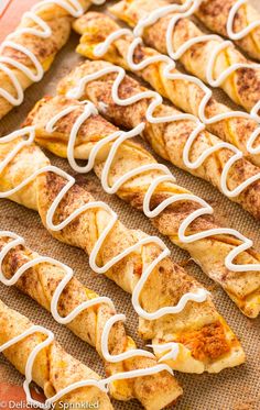 several pieces of food with white icing on them