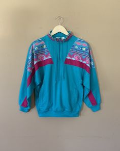 "Awesome oversized fit 90's active top. Classic 90's vintage color block design. Shirt is in excellent clean condition. Two front pockets. Super soft 100% Cotton. Fabric is a little thicker than an average t-shirt. Measurements are taken zipped or buttoned up and laid comfortably flat then x2 for total circumference Tag Size Small-Petite (True to size) Shoulders 40\" Bust 40\" Sleeve 19\" Total length 23\" Top sleeve circumference 21\" Wrist circumference 6\" Bottom hem circumference 32-38\"(str Retro Patchwork Sweatshirt For Streetwear, Oversized Multicolor Sporty Tops, Oversized Sporty Multicolor Tops, Vintage Color Block Tops For Streetwear, Sporty Oversized Multicolor Tops, Retro Color Block Sweatshirt For Streetwear, Retro Sports Sweatshirt With Relaxed Fit, Retro Blue Sweatshirt For Sports, Levis Jeans High Waisted