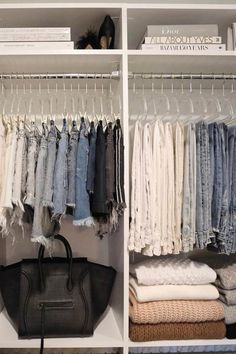 an organized closet with clothes and handbags