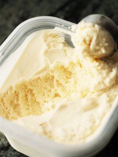 a scoop of ice cream in a plastic container