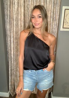 This one-shoulder tank top emphasizes a woman's attractive neck and shoulder line, crafted from high-quality satin for a silky feel. It has a relaxed fit to suit a variety of body shapes. Jeans, leggings, shorts, high-heels, sandals, and a clutch make a perfect casual pairing. Bulk tank tops can be worn for dinners and nights out alike. Chic Silk One Shoulder Top For Party, Chic Silk One-shoulder Top For Party, One-shoulder Silk Top For Spring, Chic Silk One Shoulder Top With Asymmetrical Neckline, Chic Satin One Shoulder Top For Party, Off-shoulder Tank Top For Night Out In Summer, Chic One-shoulder Tank Top For Night Out, Satin One Shoulder Top For Party, Chic Satin One-shoulder Top For Party