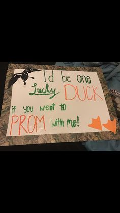 a sign that says i'd be one lucky duck if you went to prom with me