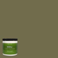 a can of paint that is green and has the words behre on it