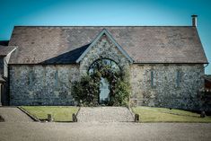 an old stone building with a large arched doorway