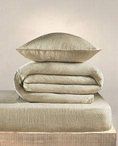 three pillows stacked on top of each other