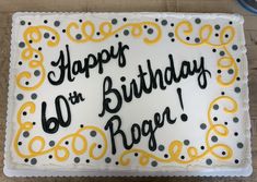 a birthday cake with white and yellow frosting that says happy on the 60th roger