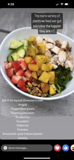 a white bowl filled with lots of different types of fruit and vegtables