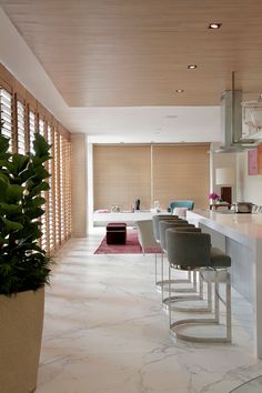 the kitchen is clean and ready to be used for dinner or breakfast time, as well as bar stools