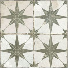 a white and green tile with star designs on it's sides, in different sizes