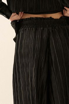 Pleated satin pants. Wavy pleat texture. Wide leg. Paperbag elastic waist High waist. Loose fit. 100% Polyester. Imported. Designed in LA. Model wears size S. Black Palazzo Pants, Wide Leg Palazzo Pants, Satin Pants, Palazzo Pants, Elastic Waist, High Waist, Wide Leg, Loose Fitting, High Waisted