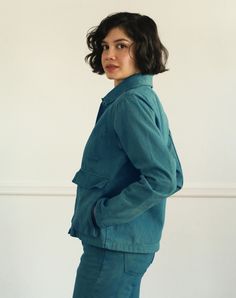 'A' line loose fitting jacketPointed CollarTwo drop-in flap pockets with side-entry hand pockets underneathInside chest pocketFront button closureFully deconstructed100% Recycled Cotton Twill, 12 OzCorozo buttons In Collaboration with The New Denim ProjectMade in Guatemala by La Workshop Dyed with Indigo by Green Matters Natural Dye Company Sarah wears size SFeatured with Leonardo pant and Tomás sweater*Color may vary from batch to batch due to the use of natural dyes Womens Utility Jacket, Denim Projects, Sustainable Textiles, Garment Factory, Alpaca Sweater, Natural Dye, Sweater Blouse, Utility Jacket, Chic Design