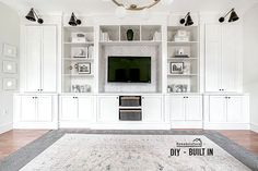 a living room with white built in cabinets and a large rug on the floor next to it