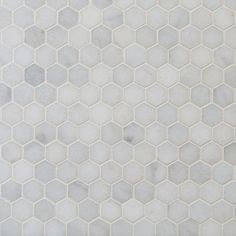 a white marble tile with hexagonal pattern