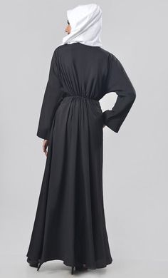 A well chemistry of simplicity in modest wear. The abaya includes gathers detailing on body and very beautiful bishop sleeves for enhancing the look and included pockets for better utility. Color: AS PICTURED Pattern: Normal Abaya Abaya Type: FRONT NECK DEEP PREFER TO WEAR YOUR OWN MATCHING INNER FOR YOUR BETTER LOOK Work: Intricate beads and dori (and work color will be common in all other colors as shown in an image) ATTACHED DORI WITH TESSELS Fabric : KASHIBO This Abaya Has V-Neckline and Ful Long Sleeve Abaya For Work, Solid Color Long Sleeve Abaya For Work, Solid Long Sleeve Abaya For Work, Solid Color Maxi Length Abaya For Work, Solid Maxi Length Abaya For Work, Maxi Length Abaya For Fall Workwear, Fall Workwear Abaya In Maxi Length, Fall Workwear Maxi Length Abaya, Modest Long Sleeve Abaya For Work