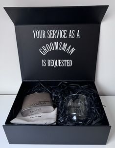 the grooms gift box is filled with personal items for his wedding day, and includes two matching hats