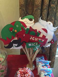 a table with candy and decorations on it