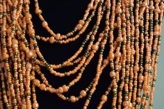 Unique African Maasai Handcrafted Beaded Necklace with an Elegant Look and Brilliant Finish.Circumference = 23 Inches / 60 Centimeters.Color = Carrot Orange and Copper.**GET FREE SHIPPING FOR ADDITIONAL ITEMS PURCHASED.Yes, Buy Multiple Items and pay shipping for 1 item only- The rest ships Free. (No Limits on the number of Multiple items). With a faster delivery time of 3 days via DHLExpress, Worldwide. Ordinary/Standard Shipping also available upon request.  We Custom Make to Suit Your Taste.A Traditional Orange Necklaces With Dangling Beads, Traditional Orange Necklace With Dangling Beads, Traditional Brown Beaded Chain, Orange Vintage Beaded Necklace For Festival, Vintage Orange Beaded Necklace For Festival, Traditional Brown Multi-strand Necklaces, Orange Multi-strand Bohemian Beads, Traditional Multi-strand Wooden Bead Necklaces, Gray Necklace