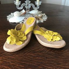 Boc: Yellow Flower Sandals Size 6 Never Worn Decorative Yellow Leather Flower Cushioned Soles Casual Flower-shaped Sandals For Summer, Casual Summer Sandals With Flower Shape, Casual Floral Print Sandals For Spring, Flower Shaped Synthetic Heels For Summer, Synthetic Summer Heels With Flower Design, Summer Flower Heels In Synthetic Material, Summer Flower-shaped Synthetic Flip Flops, Spring Floral Print Flat Sandals, Casual Beach Sandals With Flower Design