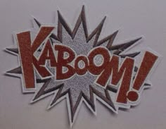 the word kaboom is written in red and silver