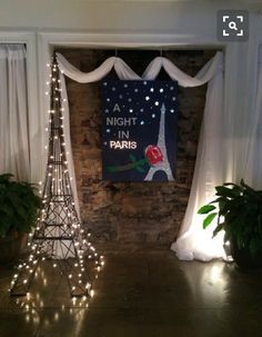 the eiffel tower has been decorated with lights and drapes for an event