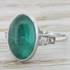 Edwardian 6.57 Carat Cabochon Emerald Solitaire Ring, circa 1910 by GatsbyJewels on Etsy https://www.etsy.com/uk/listing/267900263/edwardian-657-carat-cabochon-emerald Gatsby Jewelry, Emerald Solitaire Ring, Gatsby, Solitaire Ring, Rings Statement, Turquoise Ring, Colored Diamonds, Statement Rings, Diamond Cuts