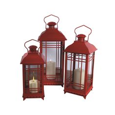 three red lanterns sitting on top of a table next to each other with candles in them