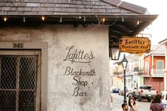 the sign on the building says, lahttes blacksmithnut shop and bar