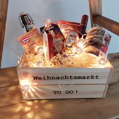 a wooden crate filled with food and snacks