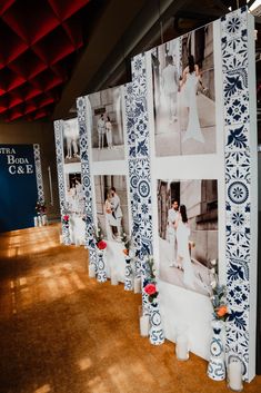 the wall is decorated with photos and vases