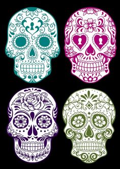 three sugar skulls in different colors