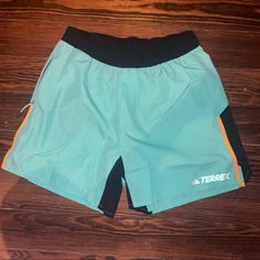 Brand New No Tags Women’s Hiking Shorts Teal/Black/Yellow Side And Back Zipper 100% Recycled Polyester Light Weight Green Athleisure Bottoms For Outdoor, Yellow Bottoms With Pockets For Outdoor, Stretch Green Hiking Bottoms, Green Stretch Hiking Bottoms, Yellow Sporty Bottoms For Outdoor, Sporty Yellow Bottoms For Outdoor, Adidas Sporty Bottoms For Outdoor Activities, Sporty Adidas Bottoms For Outdoor, Green Short Length Bottoms For Outdoor