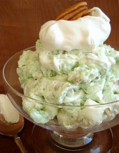 a glass bowl filled with ice cream and pretzels