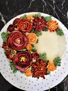 there is a cake decorated with flowers on the plate