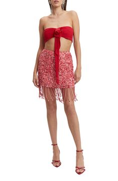 Beaded fringe sways with every step you take in this party-ready miniskirt covered in sparkly sequins. 14" length Exposed back-zip closure Partially lined 100% polyester Hand wash, line dry Imported Fitted Party Bottoms With Beaded Fringe, Summer Sequin Dress With Fringe, Summer Party Skirt With Beaded Fringe, Fitted Fringe Skirt For Party, Fitted Fringe Skirt For Party Season, Party Fitted Fringe Skirt, Summer Party Bottoms With Beaded Fringe, Party Season Fringe Skirt For Night Out, Sequin Party Skirt For Festivals