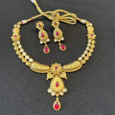 Rajwadi Kundan Ruby Necklace/ Golden Designer Temple Jewelry Necklace / Kundan Ruby Emerald Jadau Necklace/ Indian Wedding Jewelry Traditional Temple Jewelry/ Matte Gold Kundan Necklace Set Made in Brass with Matte Gold finish with Kundan Stones and Ruby stones.  Handcrafted To Perfection Light Weight Jewelry Perfect For Indian Weddings And Celebrations A Beautiful & Memorable Gift for Weddings and Special Occasions This necklace comes with Golden Thread Dori extension for flexible fitting Earri Gold Bridal Sets With Pallu For Traditional Ceremonies, Ceremonial Cutdana Jewelry Set For Diwali, 22k Gold Chandbali Bridal Necklace With Pallu, Elegant Bridal Necklace With Zari Work For Puja, Elegant Bridal Necklace For Navratri Puja, Elegant Meenakari Bridal Necklace For Traditional Ceremonies, Elegant Bridal Sets For Traditional Ceremonies, Gold Kundan Necklace With Meenakari For Traditional Ceremonies, Traditional 22k Gold Kundan Necklace For Puja