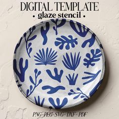 a blue and white plate on a wall with the words digital template glaze stencil