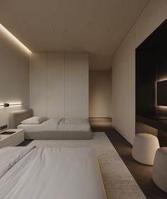 two beds in a room with white sheets and pillows on the floor next to each other