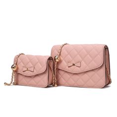 Meet the Blossom Quilted Shoulder Bag set- a delightful pairing designed for the modern sophisticate with a flair for fun. Fashioned from quilted fabric and adorned with a charming bow embellishment, these bags offer both style and practicality. With adjustable straps for comfort and convenience, they effortlessly adapt to your daily adventures. Embrace the playful elegance of Blossom- perfect for the young-at-heart sophisticate. Quilted Shoulder Bag, Shoe Boot Sandals, Purse Accessories, Slipper Socks, Large Bag, Bag Set, Crossbody Strap, Handbag Accessories, Interior Details