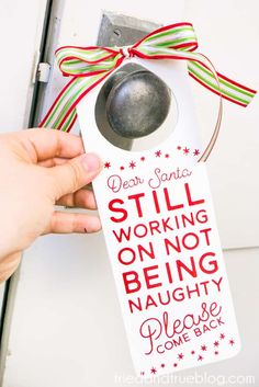 a door hanger that says dear santa still working on not being naught