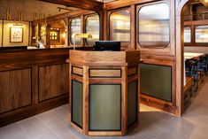 the interior of a restaurant with wood paneling