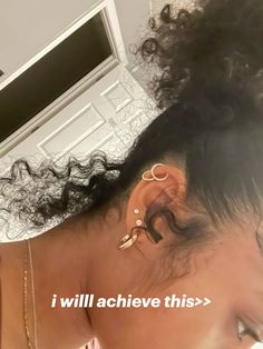 an image of a woman with ear piercings on her head and the words i will achieve this