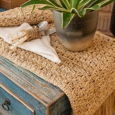 a close up of a table with a potted plant