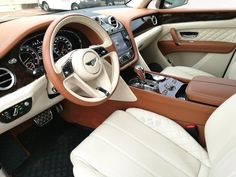 the interior of a luxury car is clean and ready to be driven