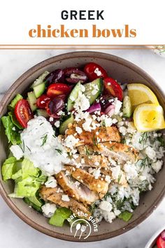 greek chicken bowls with feta cheese, cucumber, tomatoes and lemon wedges