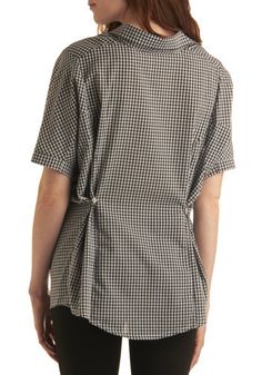 a woman in black and white checkered shirt