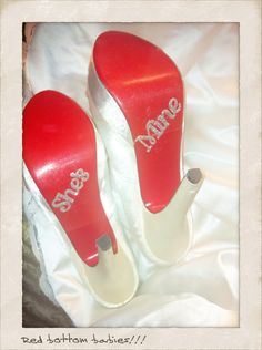 two pairs of red shoes with the word mrs and mr written on them in white