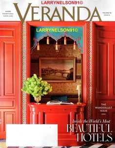 the front cover of veranda magazine with a red cabinet and potted plant in it