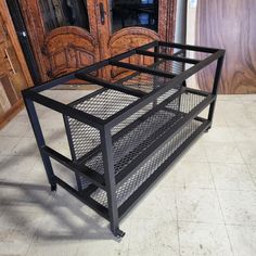 a metal cage is sitting on the floor