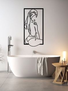 a bathroom with a bathtub and table next to the tub is decorated in black and white